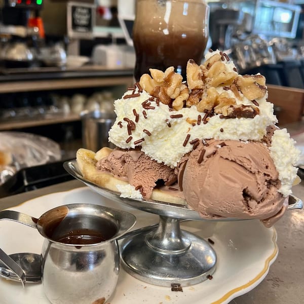 A Hildebrandt's banana split with chocolate ice cream, whipped cream, walnuts, and sprinkles.