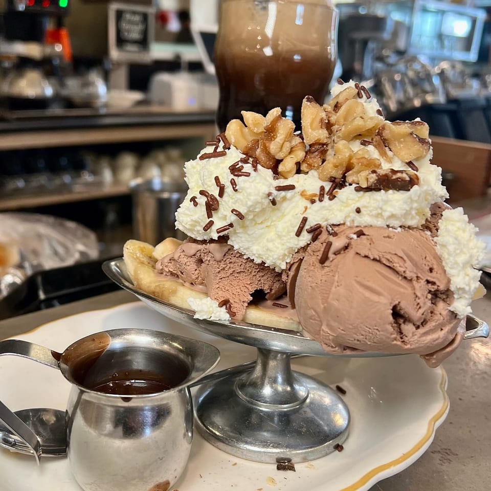 A Hildebrandt's banana split with chocolate ice cream, whipped cream, walnuts, and sprinkles.