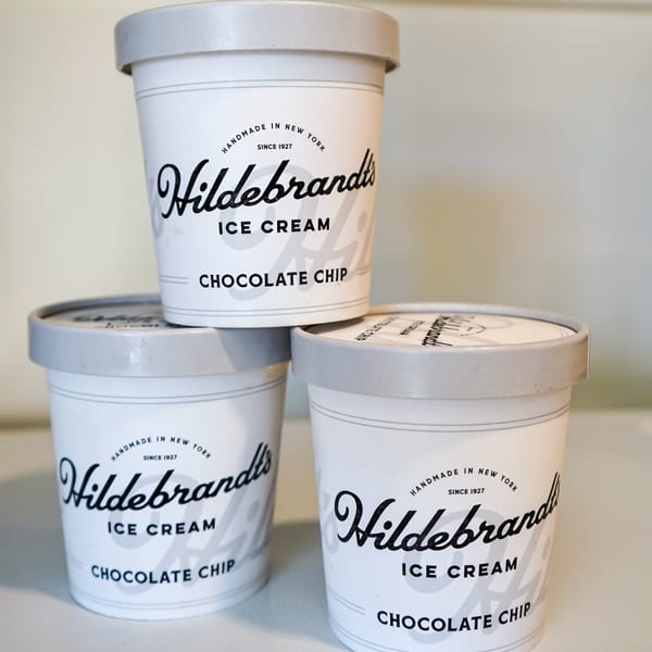 Three stacked Hildebrandt's Chocolate Chip ice cream pints with gray lids.